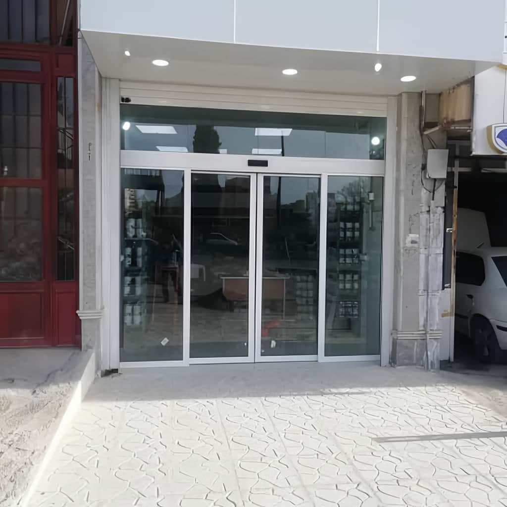 قیمت درب اتوماتیک شیشه ای لولایی با اپراتور ساده قیمت درب اتوماتیک شیشه ای لولایی با اپراتور ساده